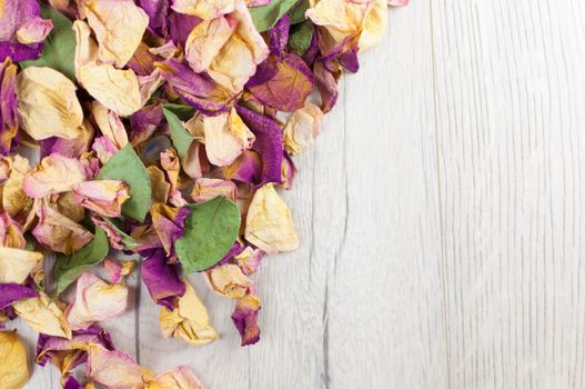 bouquet dried roses on wood background with copy space