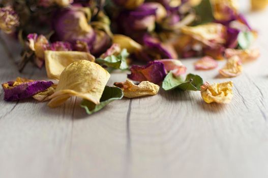 bouquet dried roses on wood background with copy space