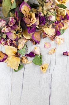 bouquet dried roses on wood background with copy space