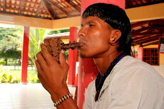 porto seguro, bahia / brazil - april 13, 2009: Indians of the Pataxo ethnicity are seen in the village of Barra Velha, in the municipality of Porto Seguro.