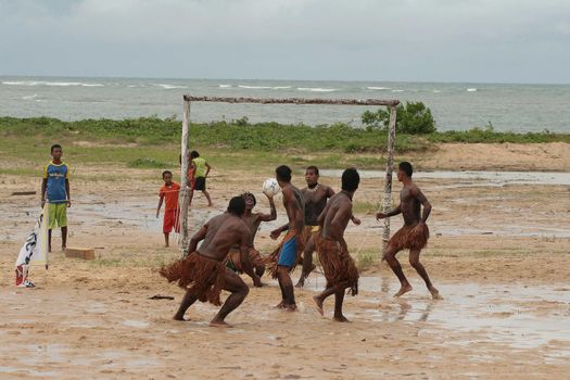 santa cruz cabralia, bahia, brazil - april, 2009: Indians of the Pataxo ethnicity playing a soccer match during indigenous games in the Coroa Vermelha village in southern Bahia.