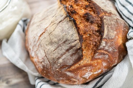 Freshly baked sourdough rye loaf of bread.