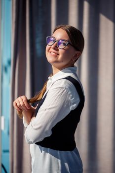 Confident business woman boss standing in modern office wearing glasses, female leader, business owner thinking about future success, planning new opportunities