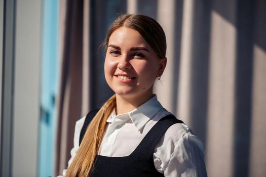 Confident business woman boss standing in modern office, female leader, business owner thinking about future success, planning new opportunities