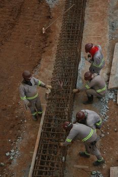 salvador, bahia, brazil - november 30, 2021: Construction worker preparing hardware for a transit project in Salvador city