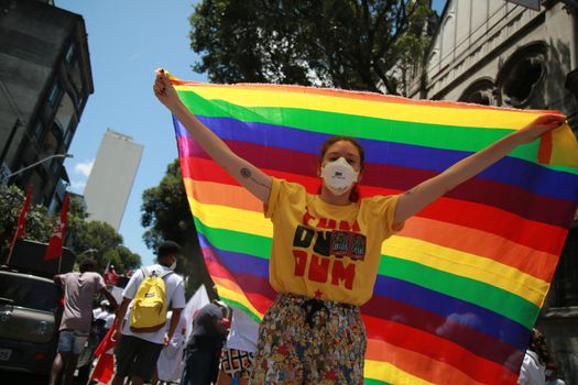 salvador, bahia, brazil - september 7, 2021: demonstrator carries gay pride flag during demonstration in Salvador city.