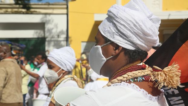 salvador, bahia, brazil - november 20, 2021: Candomble members and black entities participate in washing the statue of black leader Zumbi dos Palmares in the Historic Center of the city of Salvador.