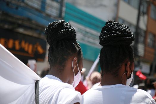 salvador, bahia, brazil - september 7, 2021: young people of black ethnicity wearing hair braids are seen in the city of Salvador.