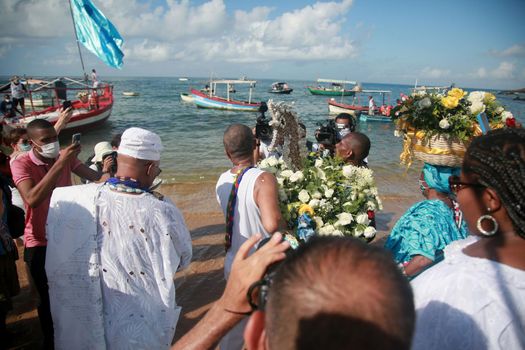 salvador, bahia, brazil - february 2, 2022: Candomble devotees and supporters of the African matriaz religion pay tribute to the orixa Yemanja in the city of Salvador.