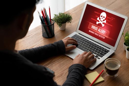 Virus warning alert on computer screen detected modish cyber threat , hacker, computer virus and malware