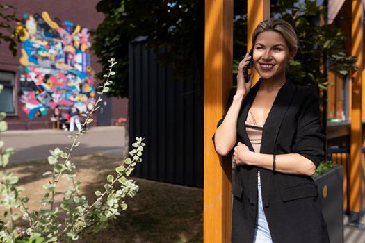 woman self-employed person talking on the phone in the city.