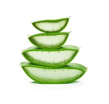 Close up stack of fresh green Aloe Vera slices full of juicy gel isolated on white background, low angle view