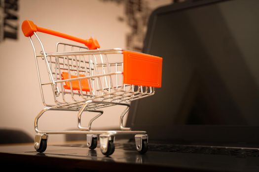 Online shopping illustration concept shot with miniature cart