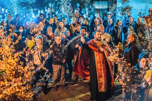 Montenegro, Budva 7.01. 2021: Christian Christmas in Montenegro, the feast of the oak branch. People burn an oak branch in honor of Christmas.