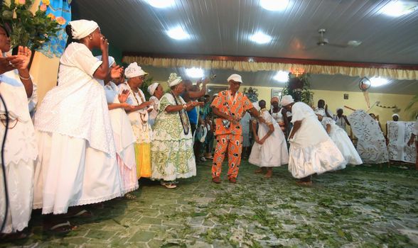 simoes filho, bahia, brazil - february 27, 2016: followers of candomble religion during religious festivities in a cndomble yard in the city of Simoes Filho.