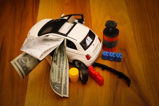 Car expenses illustration with miniature objects