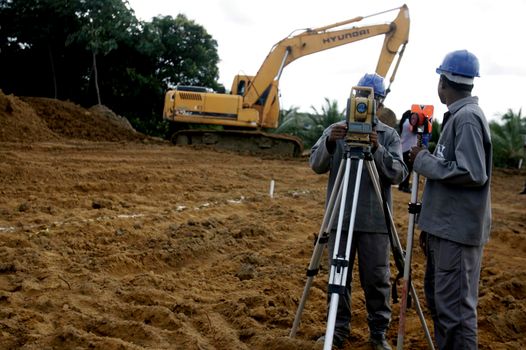 salvador, bahia / brazil - march 3, 2016: surveyor is seen making measurements under construction at the Municipal Hospital in the city of Salvador.
