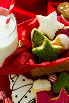 Assorted christmas cookies on red background.