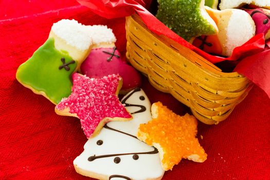 Assorted christmas cookies on red background.