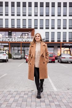Beautiful stylish woman posing in fashionable clothes in leather shoes. Casual style. Urban fashion style. New collection of spring women's shoes