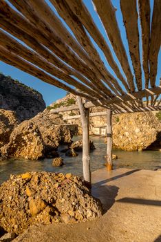 Turquoise waters in Es Portitxol, Ibiza, Spain. Hidden bay on the Island of Ibiza, in Sant Joan de Labritja.