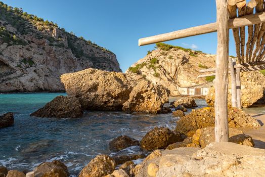 Turquoise waters in Es Portitxol, Ibiza, Spain. Hidden bay on the Island of Ibiza, in Sant Joan de Labritja.