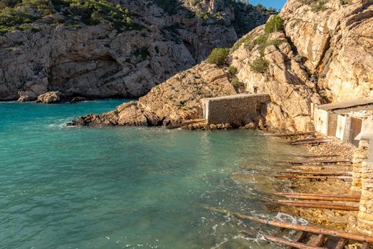 Turquoise waters in Es Portitxol, Ibiza, Spain. Hidden bay on the Island of Ibiza, in Sant Joan de Labritja.