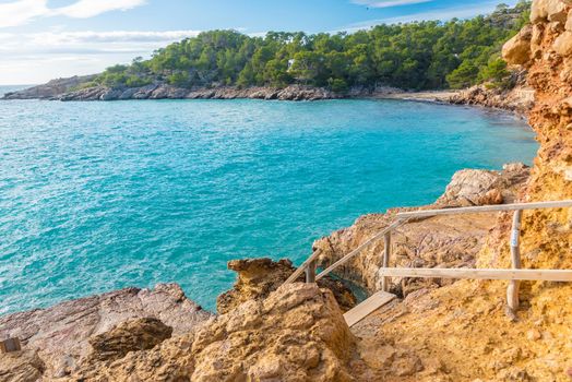 Cala Salada and Saladeta in san Antonio Abad at Balearic Islands Spain. Typical house for fishing boats and rocks.