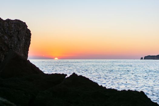 Beautiful Sunset in Cala Comte Beach, Sant Antoni de Portmany, Ibiza, Balearic Islands, Spain.