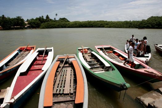 porto seguro, bahia / brazil - november 4, 2009: Tourist transport vessels are seen in the port of Rio Caraiva, Porto Seguro district.