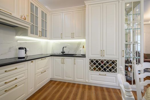 White luxiry modern classic kitchen furniture with wine rack, corner view