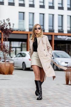 Beautiful stylish woman posing in fashionable clothes in leather shoes. Casual style. Urban fashion style. New collection of spring women's shoes