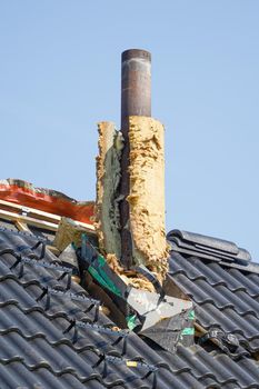 Image of Installation of chimney with exposed isolation layer on the roof