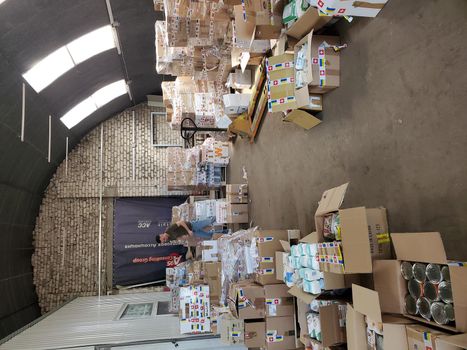 Food humanitarian aid for Ukraine sorted in parcels before send out to temponary moved persons. Dnipro, Ukraine - 06.30.2022
