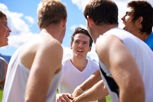 Team camaraderie. a group of young men training outdoors