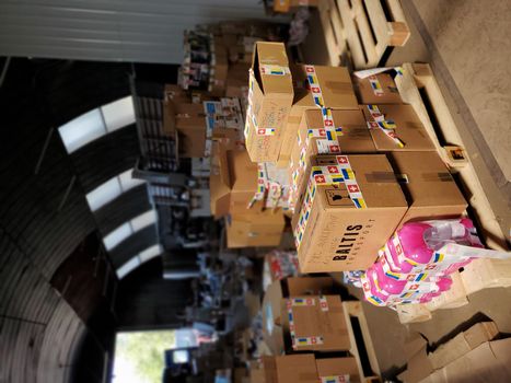 Boxes with humanitarian aid for Ukraine in volunteer centre warehouse. Dnipro, Ukraine - 06.30.2022