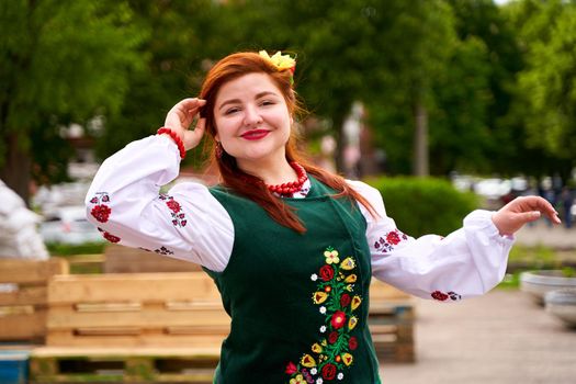 Portrait of gorgeous Ukrainian women in national dressing. Ukrainian vyshyvanka day. Dnipro, Ukraine - 06.30.2022