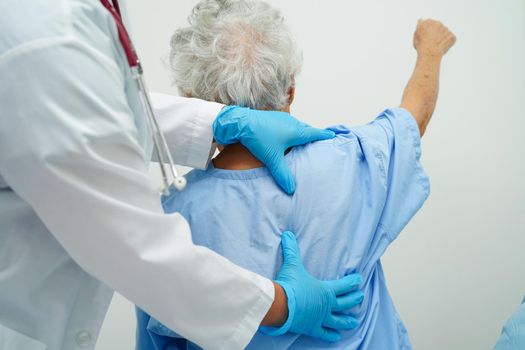 Asia doctor with stethoscope checking elderly woman patient in hospital, healthy medical concept.