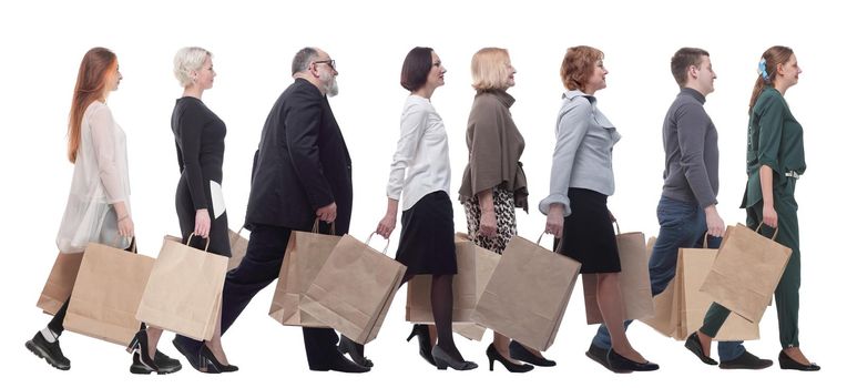 a group of people stand in line with shopping bags. isolated on white