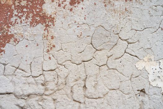 Brown peeled paint on old wall close up.