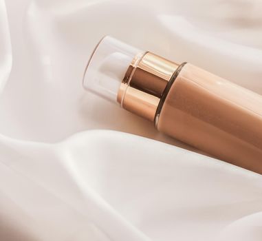 Cosmetic branding, glamour and skincare concept - Tonal bb cream bottle make-up fluid foundation base for nude skin color on silk background, cosmetics product as luxury beauty brand holiday design