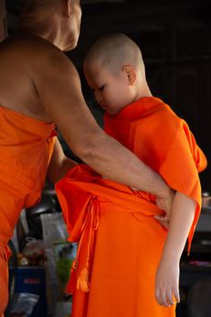 Ang Thong, Thailand - October 23, 2016 : Unidentified asian boy in ordination ceremony in buddhist for ordain become a novice monk or little neophyte in ordination ceremony in buddhist in Thailand