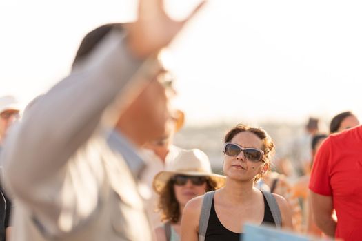 Tourists listening to the explanations of a guide at the Egyptian temple of Kom Ombo