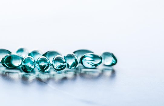 Pharmaceutical, branding and science concept - Blue pills for healthy diet nutrition, supplements pill and probiotics capsules, healthcare and medicine as pharmacy and scientific research background