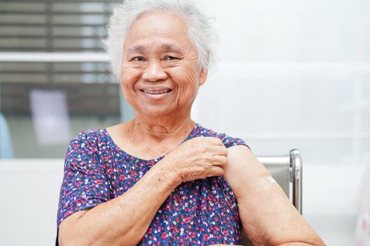 Asian elder senior woman getting vaccine for protect corona virus.
