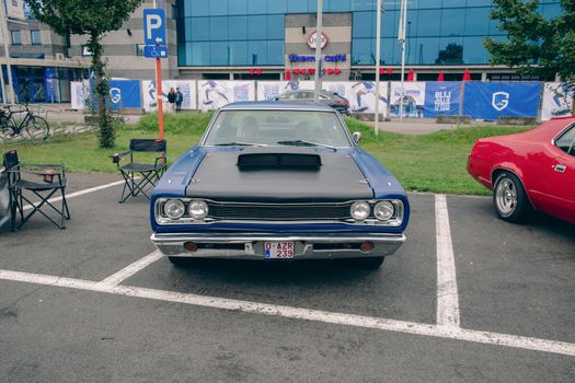 Genk, BELGIUM, August 18, 2021: classic summer meet of oldtimer at The Luminus Arena Genk, grey Ford. High quality photo