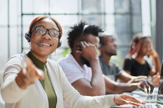 Call Center Operator With Colleagues At Workplace