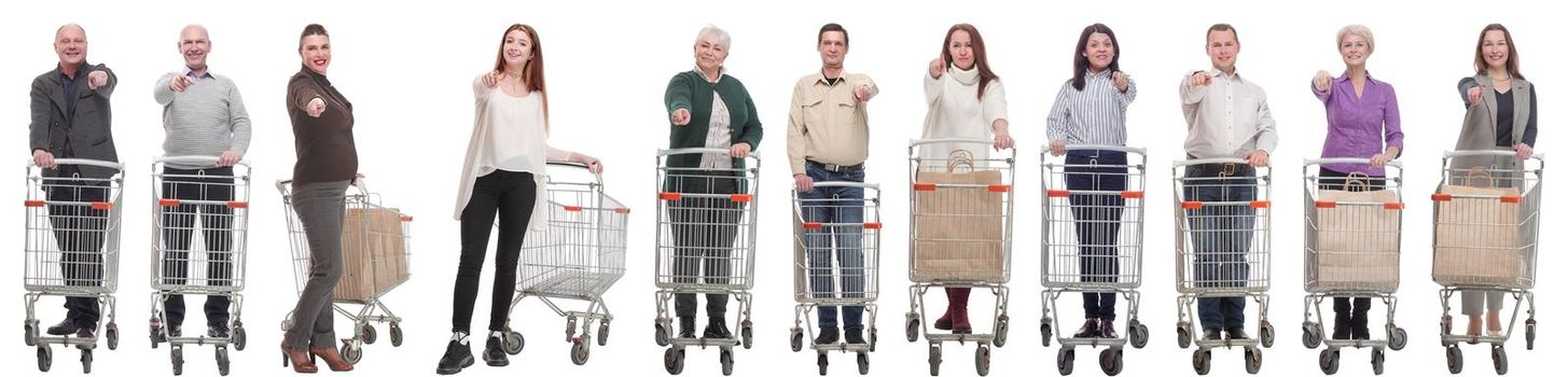 group of people with shopping cart showing thumbs up at camera isolated on white background