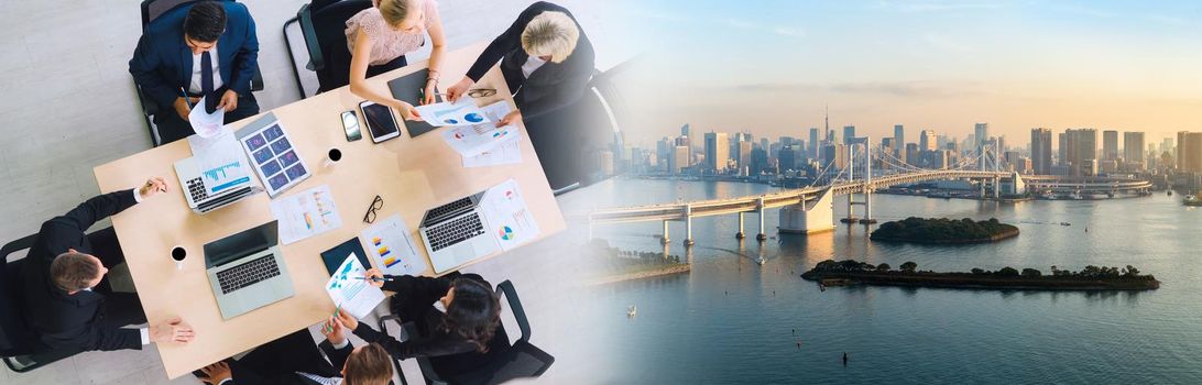 Business people group meeting shot from top widen view in office . Profession businesswomen, businessmen and office workers working in team conference with project planning document on meeting table .