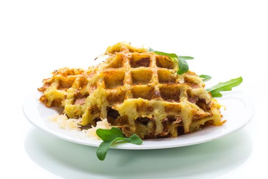 fried potato waffles with cheese in a plate isolated on white background